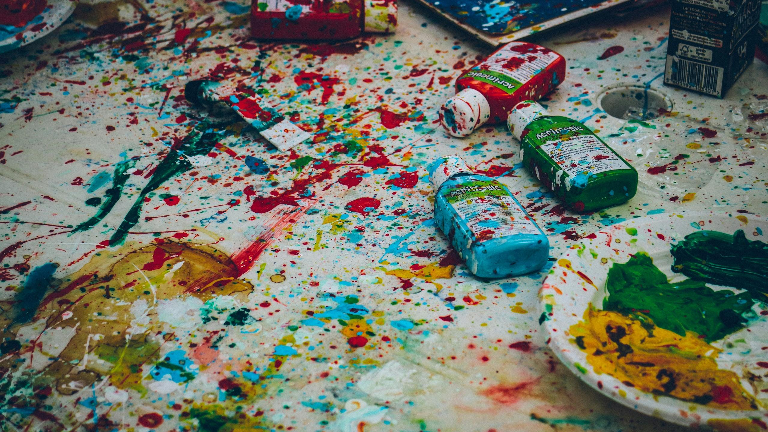 Paint bottles spread on ground