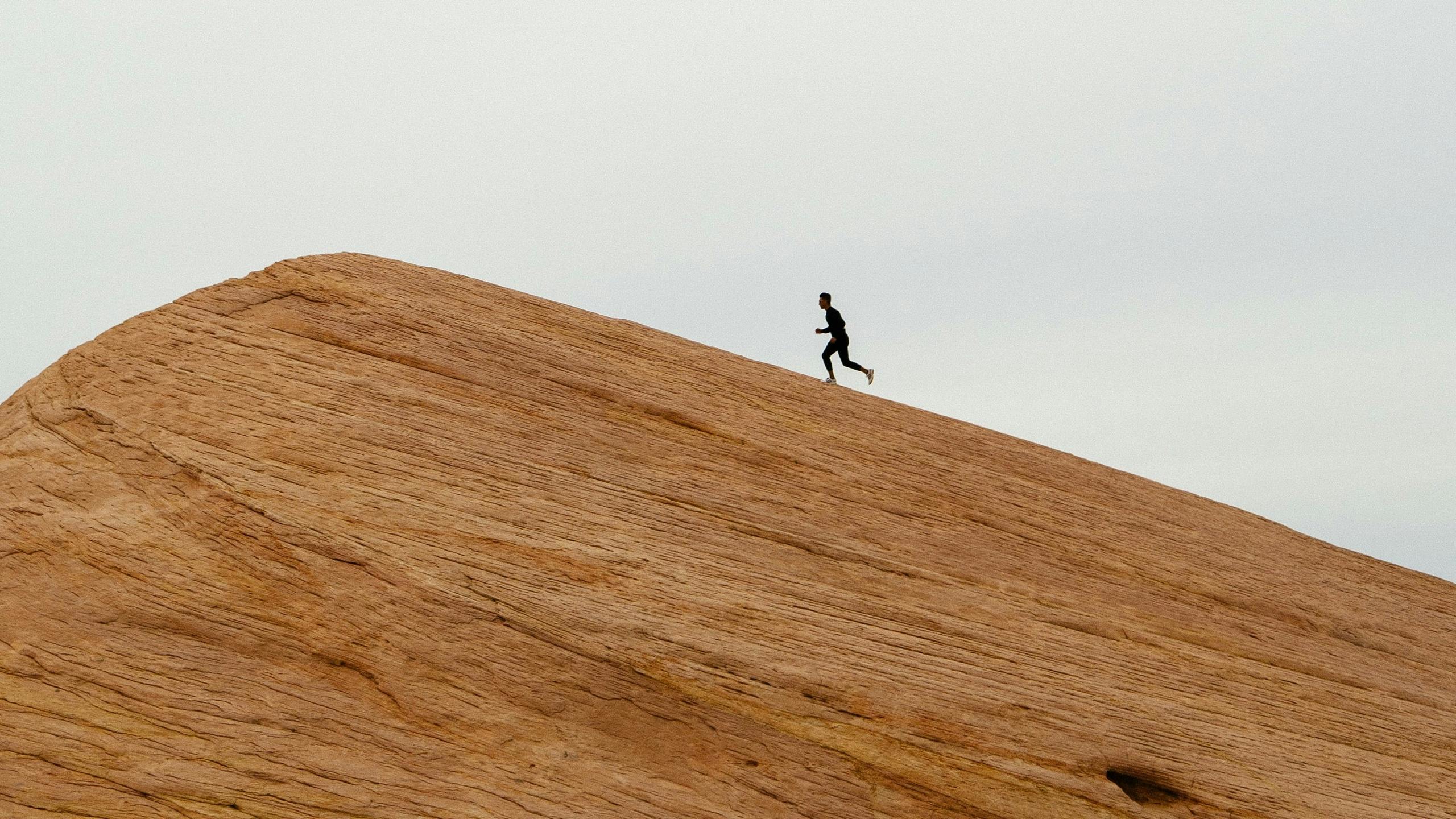 Man running up mountain