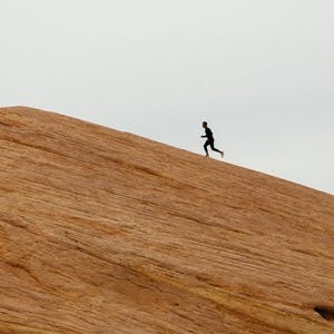 Man running up mountain