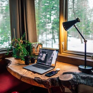 Home office overlooking snowy woods