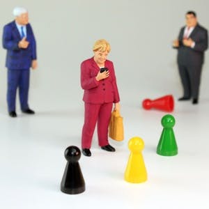 Angela Merkel doll on phone