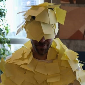Man with post-it notes on his face